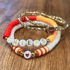 "This Chiefs bracelet set will surely add to all the game day attire perfect!  Your Chiefs a different color combo? No worries, just leave info in the personalization section!! These are standard 7\" but can be made to any requested size." Chiefs Clay Bead Bracelet, Multicolor Team Spirit Beaded Bracelets For Game Day, Personalized Multicolor Bracelets For Team Spirit, Multicolor Beaded Bracelets For Game Day, Adjustable Multicolor Beaded Bracelets For Game Day, Kansas City Chiefs Bracelets, Good Color Combos For Bracelets, Chiefs Bracelet Ideas, Midnight Bracelets