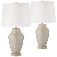 two white ceramic table lamps with shades on each lamp and an off - white linen shade