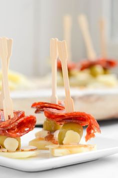 small appetizers with toothpicks and cheese on them