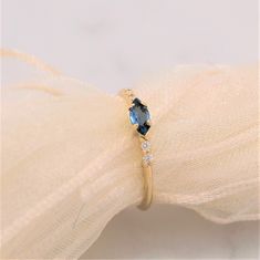 "Handmade 14K gold ring (available in white, yellow or rose gold). Middle stone is topaz \"London blue\" 6x3 mm.  4 side diamonds 0,01 ct each. Can be personalized with laser engraving. All of our jewelry is handmade in Slovenia, Europe with great affection to the smallest details. Each stone in hand carefully under microscope." Blue Topaz Ring Gold, Ring Gold Diamond, Gold Topaz Ring, Topaz Engagement Ring, Stack Ring, Ring White Gold, Gold Diamond Ring, Band Engagement Ring, Women Ring