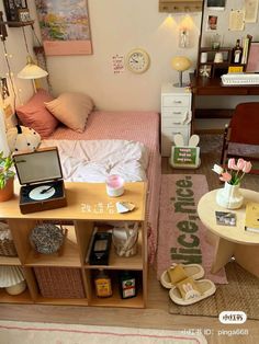 a small bedroom with a bed, desk, and chair in the middle of it