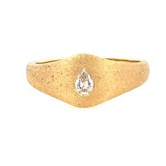 This refined signet ring from Stardust by G.St is crafted in 14k yellow gold with a satin finsih and features a solo flush set pear shaped diamond. Style on its own or in a stack. • 14k yellow gold with satin finish • 0.13ct pear shaped diamond (G-H color, SI clarity) • Band width: 8.3mm, band thickness: 2mm • In stock in size 6.5. Additional sizes will be made to order. Gold Signet Ring With Diamond Accents In 14k Gold, Gold Elegant Signet Ring With Single Cut Diamonds, Elegant Signet Ring With Diamond Accents, Fine Jewelry Yellow Gold Signet Ring With Diamond Accents, Pear Signet Ring, Diamond Signet Ring, Pear Diamond, Pear Shaped Diamond, Signet Ring