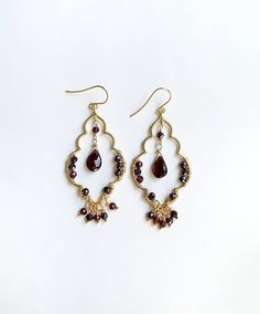 Chandelier earrings that highlight the lovely garnet gemstone. These earrings are inspired by Moroccan patterns and motifs that are captivating. Garnet Earrings, Garnet Gemstone, Chandelier Earrings, Garnet, Gemstones, Pattern, Design