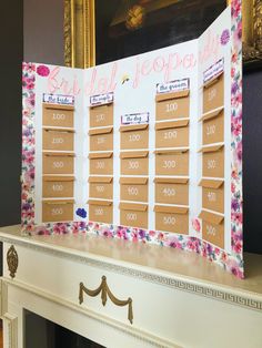 a cardboard calendar sitting on top of a mantle