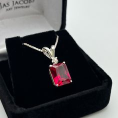 "Beautiful Ruby & White Sapphire Pendant Necklace * 4ct Emerald Cut Ruby measures 10mm x 8mm * Brilliant Cut White Sapphire accent measures 2.5mm round * Solid Sterling Silver Setting  * 18\" Sterling Silver Chain Included   Hallmarked & Gift Ready!  These Stones are Laboratory Grown. They are identical to the Natural Stone in every way including Chemistry, Composition and Hardness with excellent clarity & color refraction   TIMELESS, BEAUTIFUL & UNIQUE FINE ART JEWELRY" Bene Gesserit, Sapphire Pendant Necklace, Sapphire Necklace Pendants, Nice Jewelry, Ruby Pendant, Fine Art Jewelry, Necklace Pendants, Ruby Necklace, Sapphire Pendant