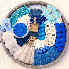 a bowl filled with lots of blue and white items