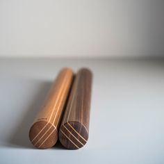 two wooden objects sitting on top of a table