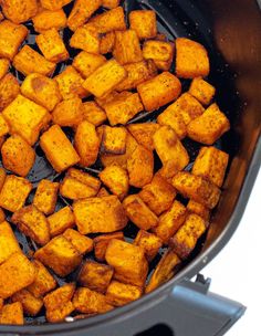 cubes of food cooking in an air fryer