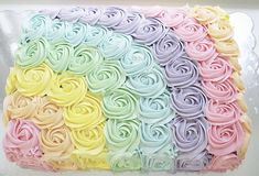 there is a cake that has been decorated with pastel colors