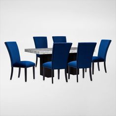 a dining table with blue chairs around it