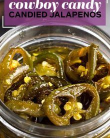 a jar filled with green peppers and corn next to a purple sign that says cowboy candy candied jalapenos