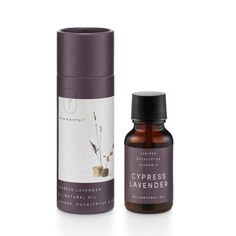 a bottle of cypress lavender essential oil next to a roll on deodorant