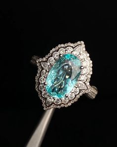 "This ring features a (8x13mm oval cut lab Made Paraiba Tourmaline). It is made by hand, and it will take about 6 to 8 days to finish the ring after your payment is completed. Main stone: 8x13mm  Cut Type: oval cut Main stone: Lab Paraiba Tourmaline  Material: 925 sterling silver/rose gold/white gold/yellow gold Accent stone: american diamond Payment Policy We accept payment through PayPal only. We have selected PayPal because it is the safest and most reliable mode of payment which enables to rapid shipping to our buyers and protects their interests. Feedback Policy Please do not leave the Negative feedback or Natural feedback before giving us a chan to resolve your problems. Positive feedback will be automatic to leave for you when you give me Positive feedback to us in 24 hours. As per Paraiba Tourmaline Ring, Wedding Anniversary Ring, Ring Halo, Paraiba Tourmaline, Wedding Anniversary Rings, Rose Gold White, Tourmaline Ring, American Diamond, Gold Accent