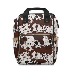 a brown and white cow print bag