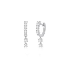 Prong Set Diamond Double Drop Mini Huggie Earring shines with .3 carats of diamonds. This fresh take on our Full Cut Diamond Arc Mini Huggie Earring delivers extra sparkle with a drop of two diamonds dangling from the base of the earrings. Go ahead, double up on style. Diamond Huggie Earrings With Sparkling Stones In White Gold, Cubic Zirconia Huggie Earrings With Prong Setting, Anniversary White Gold Huggie Earrings With Sparkling Stones, Diamond Dangle Earrings With Sparkling Stones, Fine Jewelry Diamond Earrings With Sparkling Stones, White Gold Diamond Earrings With Sparkling Stones, White Gold Diamond Huggie Earrings With Sparkling Stones, Dazzling White Gold Diamond Earrings With Sparkling Stones, Wedding Diamond Dangle Huggie Earrings