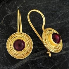 Handcrafted of a tiny disc of filigree thread, this classic Greek design highlights the beauty of a single cabochon garnet. The original Greek earrings are part of the Museum's permanent collection. 24k gold over sterling silver. Hinged backs for pierced ears. Size: 7/8 Inches. Greek Earrings, Ancient Greek Jewelry, Lapis Earrings, Greek Design, Big Jewelry, Lapis Lazuli Earrings, Greek Jewelry, Garnet Earrings, Cubic Zirconia Earrings