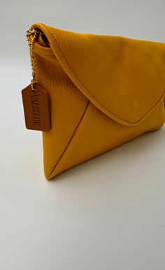 100 % genuine leather bags made in Italy Luxury Everyday Envelope Bag, Luxury Envelope Bag For Everyday, Luxury Everyday Envelope Shoulder Bag, Trendy Leather Tote Flap Bag, Luxury Leather Shoulder Bag Pouch, Smooth Grain Crossbody Bag For Shopping, Chic Pouch Clutch With Leather Lining, Versatile Soft Leather Flap Bag, Rectangular Leather Pouch For Shopping