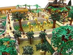 a lego model of a zoo with giraffes and other animals