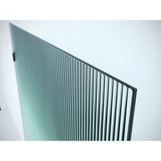 a close up view of the side of a glass door with vertical slats on it