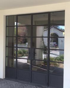 the front door to a house with large glass doors