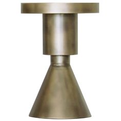 an old fashioned brass table lamp with a white light on it's top and bottom