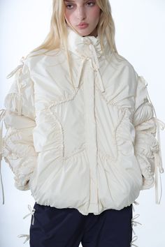 Puffer jacket in IvoryFeatures gathers throughoutZipper closure at frontPockets at sides Oversized fit, order a size down for a more fitted lookModel is 5'9 and wearing a size S Size Length Chest Waist XS 25 1/2" 47" 46 1/2" S 26" 49" 48 1/2" M 26 1/2" 51" 50 1/2" L 27" 53" 52 1/2" XL 27 1/2" 56" 55 1/2" 100% PolyesterImported Size Guide + Shipping Info Monthly payments available at checkout with Affirm. White Puffer Jacket, Hair Socks, Anti Fashion, White Puffer, Monthly Payments, Uniform Dress, Puff Jacket, Sandy Liang, Knit Outerwear