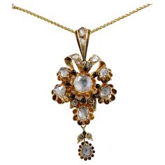 Amazing Georgian era large flower shaped Diamond pendant, can be used bypassing it through a black velvet or silk ribbon, or as pendant by its dedicated bail, which can completely separate from it Breath taking workmanship of the 18th century boasts here in all its splendour, feminine and extravagant ribboned flower, detailed with little black enamelling work to give more contrast between the large Diamonds, close back set through out Hand crafted of solid 18 Kt gold, some hallmarks present like Georgian Era, Rose Cut Diamond, Silk Ribbon, Large Flowers, Flower Pendant, Flower Shape, Rose Cut, Diamond Pendant, 18th Century