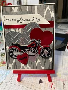 a card with a motorcycle and heart on it