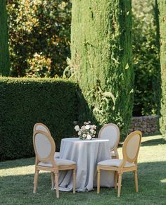 the table is set for four in the garden