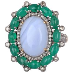 This ring is crafted in 18-karat gold and sterling silver. It is hand set in 5.67 carats opal, 2.76 carats emerald and 1.35 carats of diamonds. FOLLOW MEGHNA JEWELS storefront to view the latest collection & exclusive pieces. Meghna Jewels is proudly rated as a Top Seller on 1stDibs with 5 star customer reviews. All items manufactured by us are handmade and can be customized or redesigned. Composition Gold Weight(Gms)-1.8 Silver Weight-4.75 Diamond Wt(Cts)-1.35 Emerald Wt(Cts)-2.76 Opal -5.67 Blue Sapphire Diamond Ring, Platinum Diamond Rings, Emerald Diamond Ring, Diamond Jewelry Designs, Blue Sapphire Diamond, Diamond Cocktail Rings, Sapphire Diamond Ring, Eternity Ring Diamond, Pretty Rings