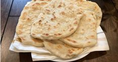 several flat breads are stacked on top of each other