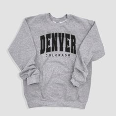 ☀️Description ☀️ We love our Denver Colorado sweatshirt because it makes the perfect Womens Denver Colorado sweater or Kids Colorado sweater. For something not so heavy checkout the Denver,CO T-shirt. Looking for a  Colorado resident Denver Sweatshirt? You've found it!  👚How To Order Your Apparel 👕 This is a physical item which means once you purchase, receive an order confirmation and tracking within 3-5 days. You will be able to track your item once it is updated with a tracking number which you can find in your purchases section. I 🗳 How we print our apparel  ➡️ We do not carry pre-printed shirts.  Once you place your order it goes into our production process with our production partner. We print our shirts using Direct To Garment printing technology. Unlike other garments decorating Winter Gray Letter Print T-shirt, Winter College Sweatshirt With Letter Print, Gray Letter Print Winter Sweatshirt, Winter Gray Sweatshirt With Letter Print, Urban Fleece Tops With Letter Print, Winter Gray Letter Print Sweatshirt, Urban Fleece Sweatshirt With Letter Print, Fleece T-shirt With Letter Print For Streetwear, College Hoodie With Letter Print And Crew Neck