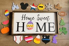 a sign that says home sweet home surrounded by cut outs