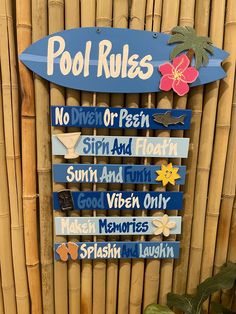 a sign that is on the side of a bamboo fence with words written in different languages