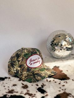 Jesus is a Cowboy Trucker Hat All Camo Real Tree Trucker Hat Western Cowboy Camo Hat Unisex Trucker Snap Back Fall Oufit Inspo Women Hat If you would like adjustments or customization to color of hat and font please message the shop ★ P R O D U C T - D E T A I L S ★ Real Tree Camo Trucker Hat Embroidered Font Adjustable Plastic Clasp in Back ★ S H I P P I N G - T I M E ★ 3-5 Business Days  ★  C A R E - I N S T R U C T I O N S  ★ Hand was with soap and cold water Air Dry For this product we do not accept returns or exchanges. If you have an issue with your order please send a message to the shop ASAP after order is placed. See shop policies for more info. SHOP OTHER HATS https://www.etsy.com/listing/1546297645/cowgirl-trucker-hat-country-theme-hat? https://www.etsy.com/listing/1537921519/wo Camo Trucker Hat, Women Trucker, Camo Hat, Country Theme, Camo Hats, Women Hat, Real Tree, Realtree Camo, Snap Back