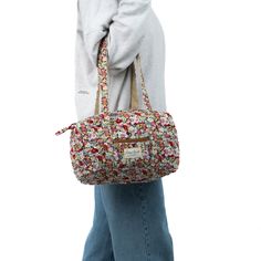 Discover elegance in compact form with our Autumn Mini Duffel Bag, a stylish carry-all with a convenient zippable front pocket,  crafted to be your perfect companion for impromptu outings or as a sleek organizer for your essentials.    The quilted exterior boasts a beautiful floral pattern, complemented by the beige interior crafted from thick and soft terry material.   From gym sessions to weekend getaways or daily errands, this mini duffel effortlessly blends organization with style, offering a chic solution for your on-the-go lifestyle.  Size: 12" x 7" x 7" Mini Duffel Bag, Mini Duffle Bag Pattern, Multicolor Quilted Travel Bag, Multicolor Duffle Bag With Removable Pouch For Daily Use, Travel Duffle Bag With Large Capacity, Multicolor, Beige Interior, Travel Duffel, Duffel Bag Travel, Backpack Tote Bag