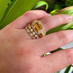 Art Déco style Godron bangle ring in 18k Gold. It is set with diamonds and with a splendid Madeira Citrine. A stunner! Please allow 4-6 weeks if out of stock. 18k Yellow Gold Size 7 - Please contact info@laurensigmancollection.com for additional sizes 2.3ctw Madeira Citrine 0.6ctw Diamonds Van Den Abeele Luxury Yellow Sapphire Rings With Diamond Accents, Luxury Asscher Cut Diamond Topaz Ring, Luxury Asscher Cut Topaz Ring With Diamonds, Luxury Diamond Halo Ring With Emerald Cut, Luxury Yellow Ring With Bezel Setting, Luxury Yellow Sapphire Jewelry With Diamond Accents, Luxury Yellow Rings With Bezel Setting, Luxury Yellow Sapphire Diamond Ring For Anniversary, Luxury Gemstone Stackable Rings For Formal Occasions