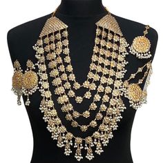 Pakistani bridal set. Includes- Mala Jhumar Tikka Earrings Gold Chandbali Jewelry Sets For Wedding, Bollywood Style Necklace With Latkans For Wedding, Bollywood Style Necklaces With Latkans For Wedding, Bollywood Necklaces With Latkans For Wedding, Bollywood Style Wedding Necklaces With Latkans, Kundan Bridal Accessories With Tilla For Marriage, Bollywood Kundan Bridal Accessories For Marriage, Bollywood Style Gold Bridal Accessories With Hand Set Details, Bollywood Chandbali Bridal Necklace For Marriage