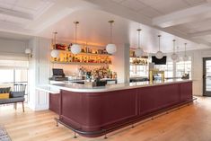 a bar with lots of bottles on the shelves