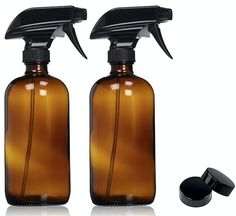 two brown glass bottles with black plastic caps