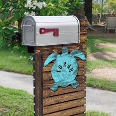 a mailbox with a sea turtle painted on it