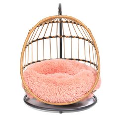 a pink chair with a round cushion on it