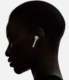 a woman with ear buds on her ears