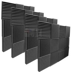 four black acoustic panels with different patterns on the sides, all lined up against each other