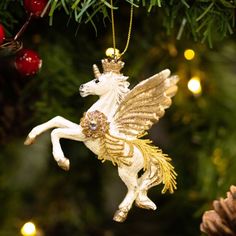 an ornament shaped like a unicorn hanging from a christmas tree