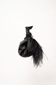 A black mini satin handbag inspired by the Furoshiki Japanese technique of wrapping with fabric. Featuring ostrich feather trim & fully lined. Perfect for brunch, cocktails, and special occasions. Large enough to comfortably fit your phone, wallet, keys, makeup, and hand sanitizer. Elegant Black Party Pouch, Black Rectangular Evening Bag For Cocktail, Elegant Black Bag For Cocktail, Black Evening Bag With Removable Pouch As Gift, Black Evening Bag With Removable Pouch, Black Clutch For Cocktail, Chic Black Bag For Cocktail Occasions, Elegant Black Cocktail Bags, Chic Black Cocktail Bag