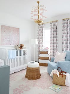 a baby's room is decorated in pink and blue