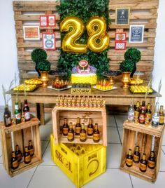 a table with beer bottles and decorations on it