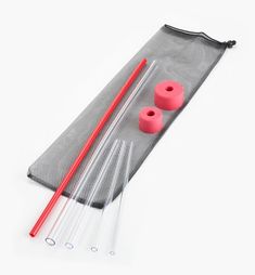 two red plastic chopsticks and some white sticks