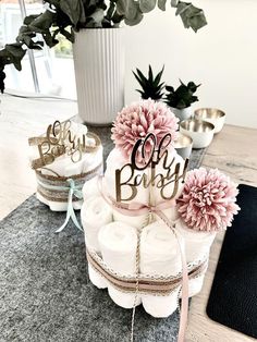 three diaper cakes sitting on top of a table